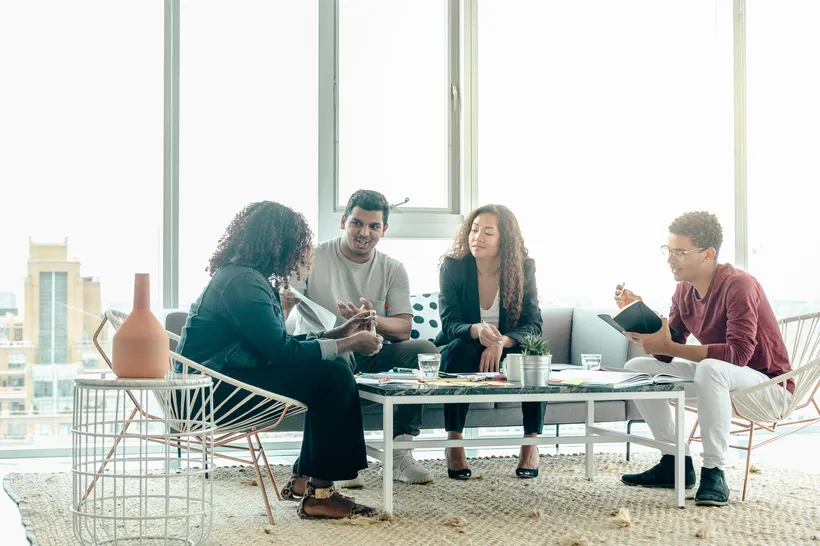 Team brainstorming together in a bright office